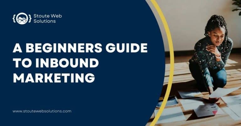 A curly woman in jeans kneels down on the floor as she looks on a piece of paper.