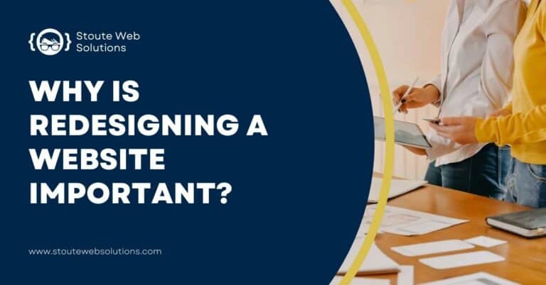 Two web developers are redesigning a website using a tablet.