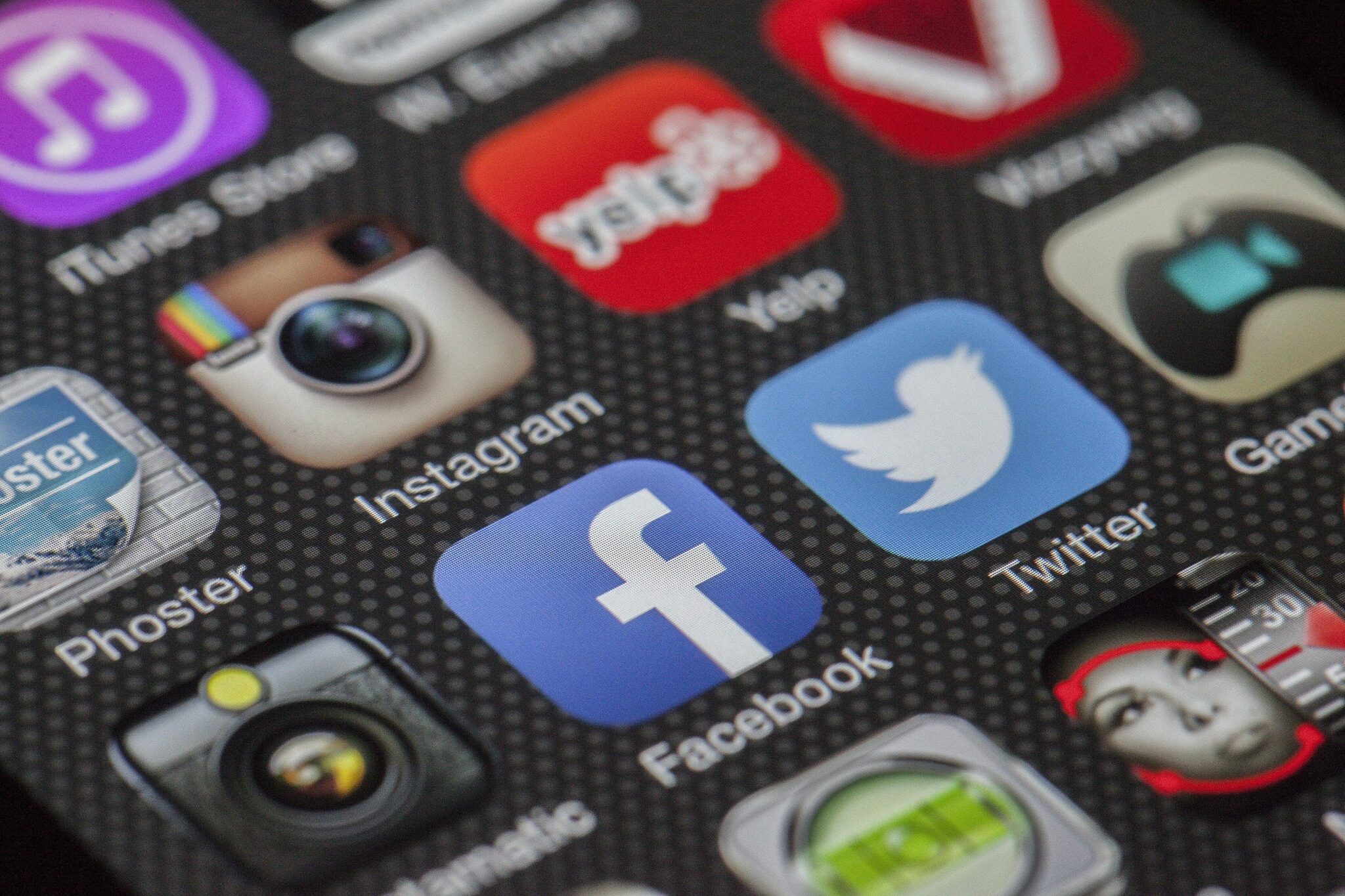 A smartphone's screen displays different social media applications.