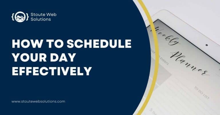 A lady's hand holding a pen and about to write on a tablet her daily schedule.