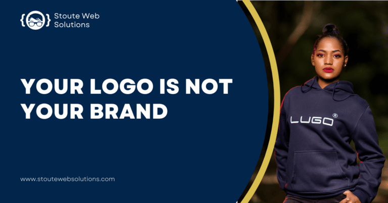 A lady models a navy blue jacket with brand logo.